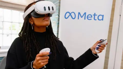 Getty Images A woman using the Quest 3 headset. It's white, clear, and shaped like glasses.  However, it looks less elegant and futuristic than Apple's product.  In comparison, you'd struggle to argue that it looks as cool as the Vision Pro.